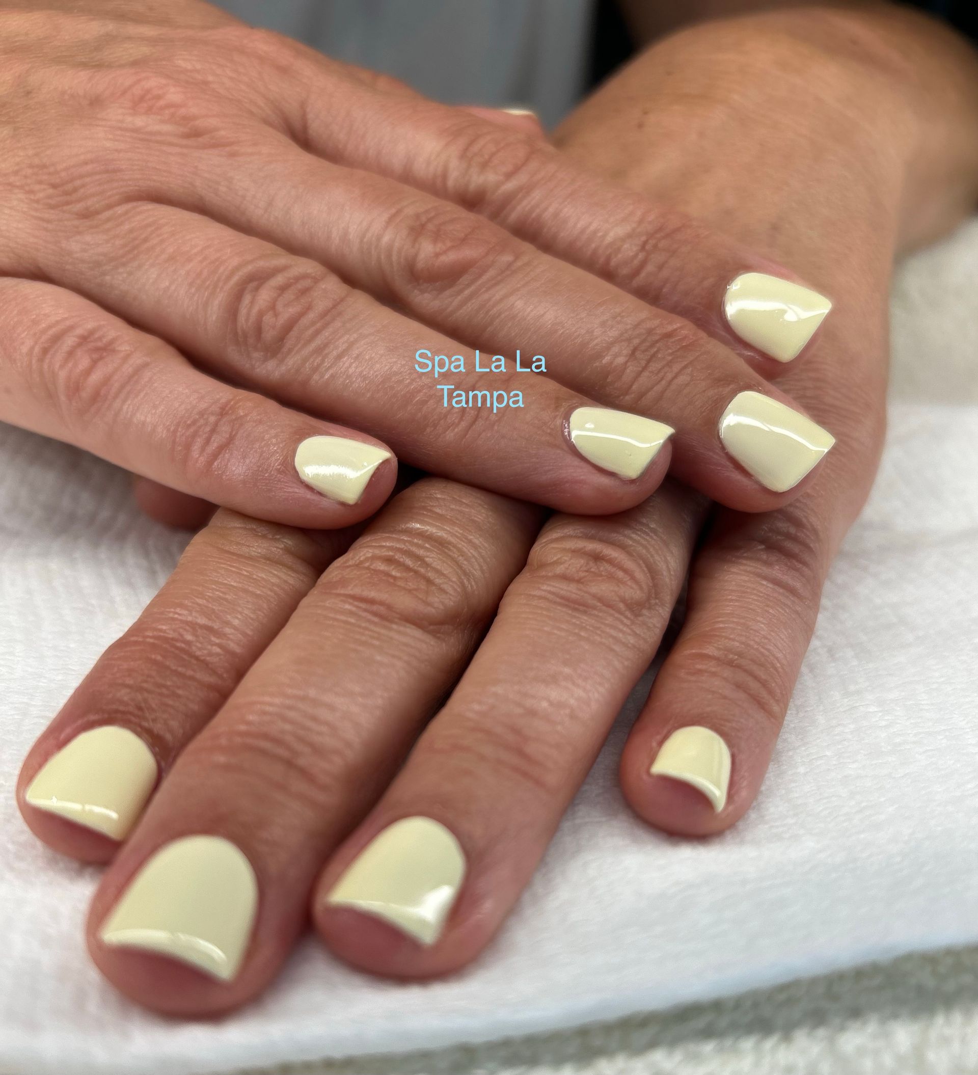 Light yellow dazzle dry nail polish manicure.