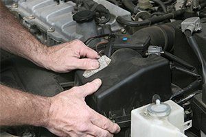 Auto Service — Mechanic Hands On Filter Cover in Lafayette, IN