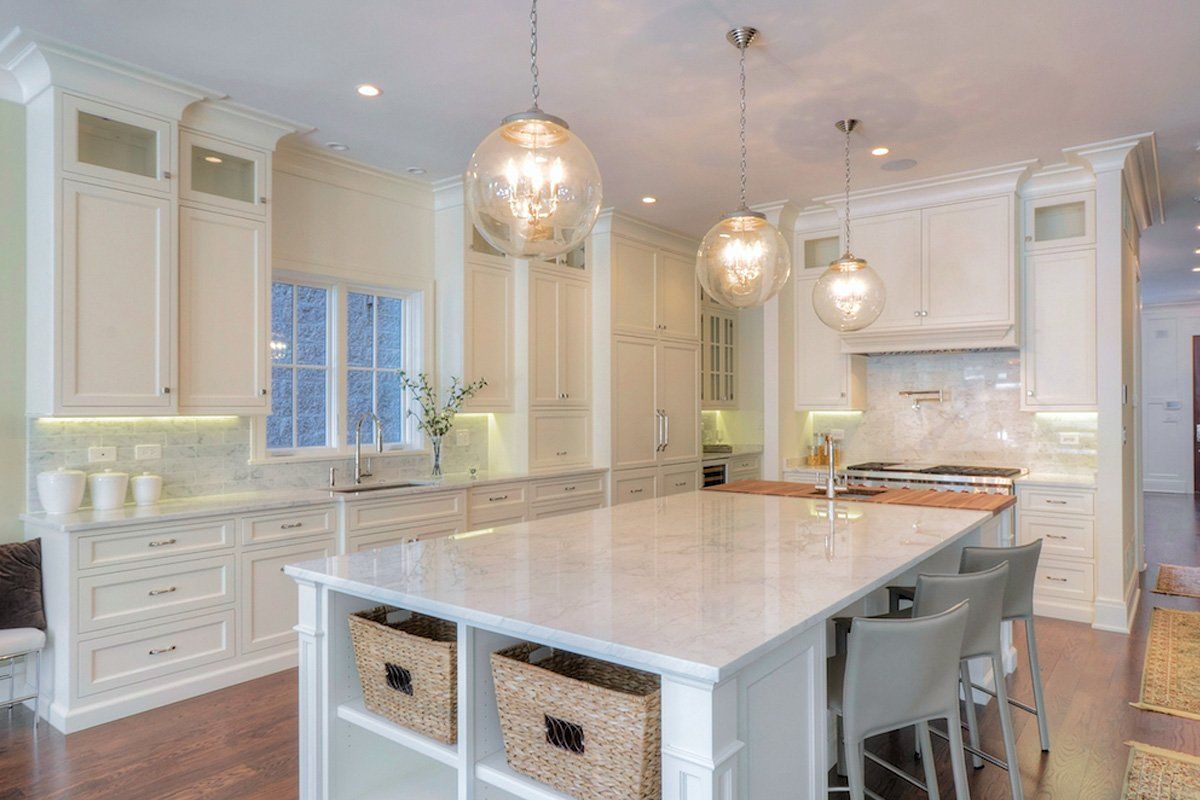 There is a large island in the middle of the kitchen.