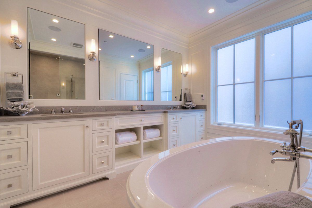 There is a bathtub in the middle of the bathroom.