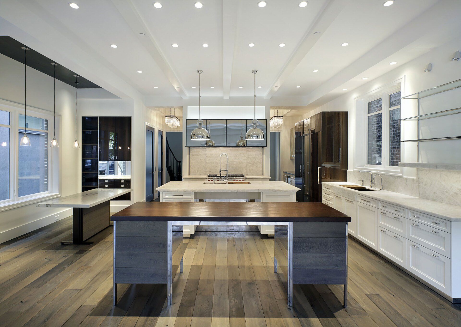 A kitchen with a large island in the middle of it