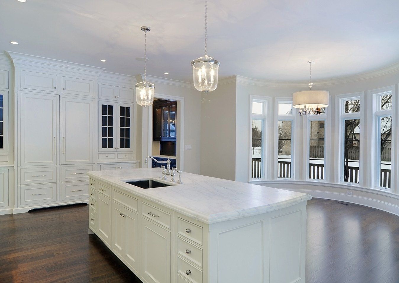 There is a large island in the middle of the kitchen.