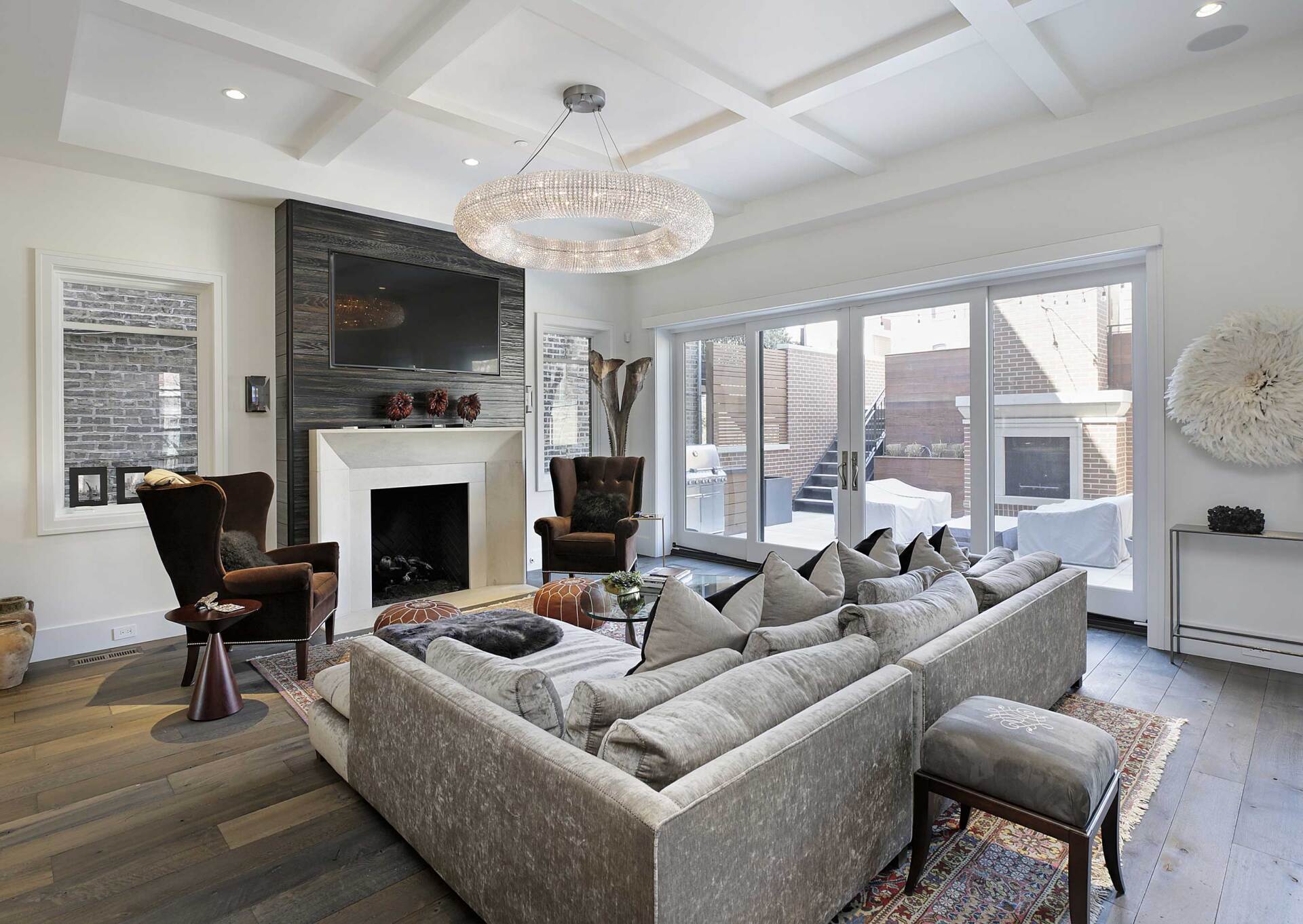 A living room with a large couch and a fireplace