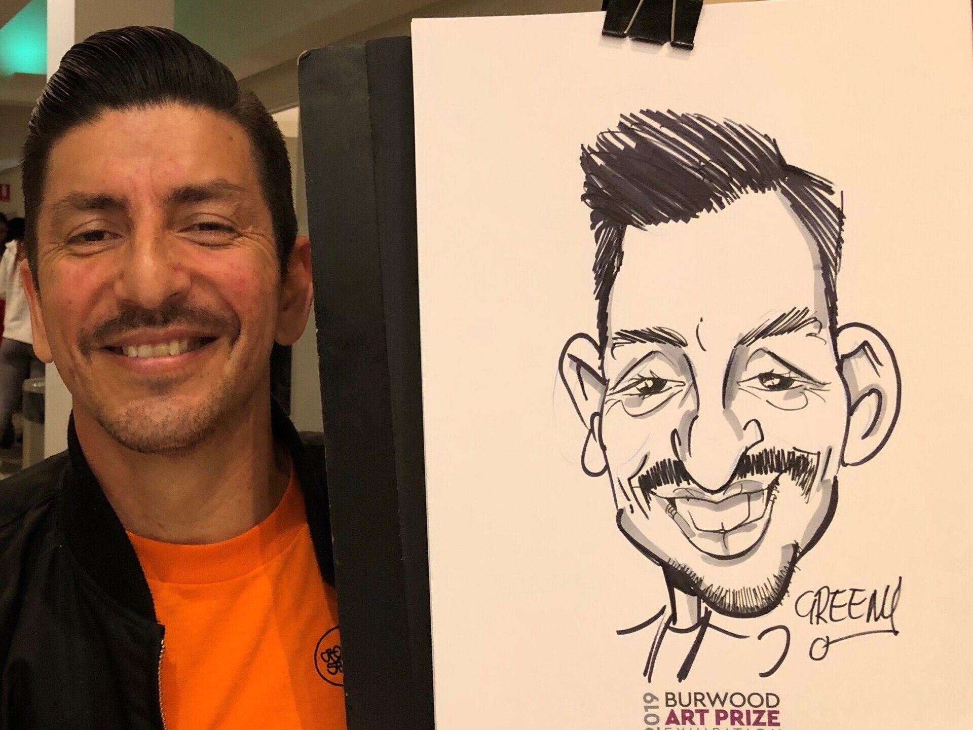Event hire cartoonist David Green drwaing live caricatures.