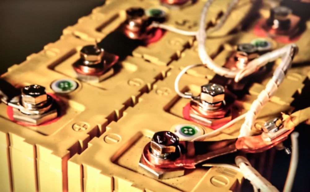 Yellow Batteries With Copper Terminals Connected by White Wires — Orange Auto Electrics in Orange, NSW