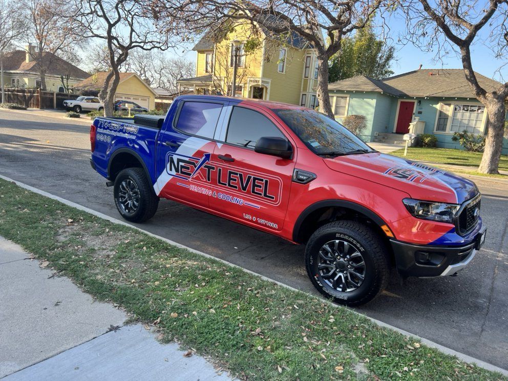 Red and blue Ford Ranger with 