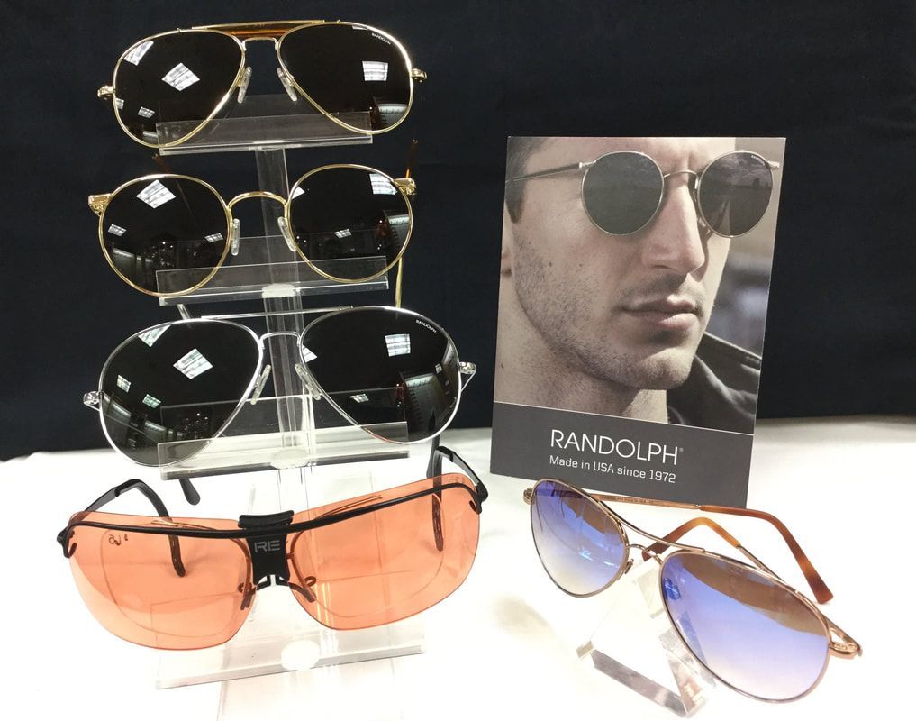 A display of sunglasses and a picture of a man wearing sunglasses.