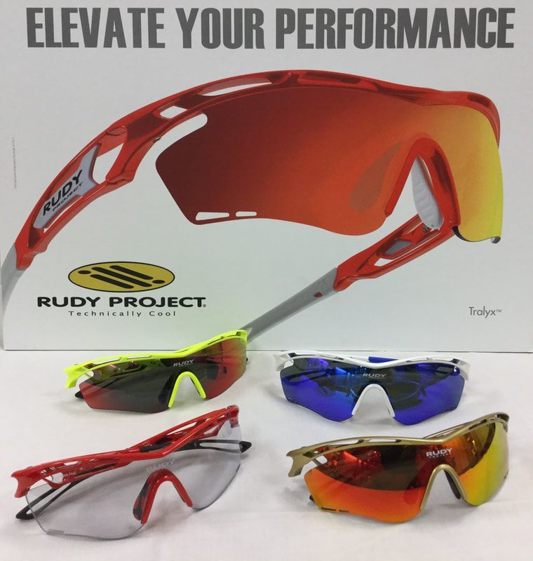 A pair of rudy project sunglasses sitting on top of a box