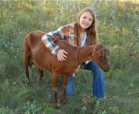 Young boy marketing his zucchini
