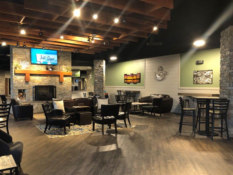 Tables and chairs inside a coffee shop
