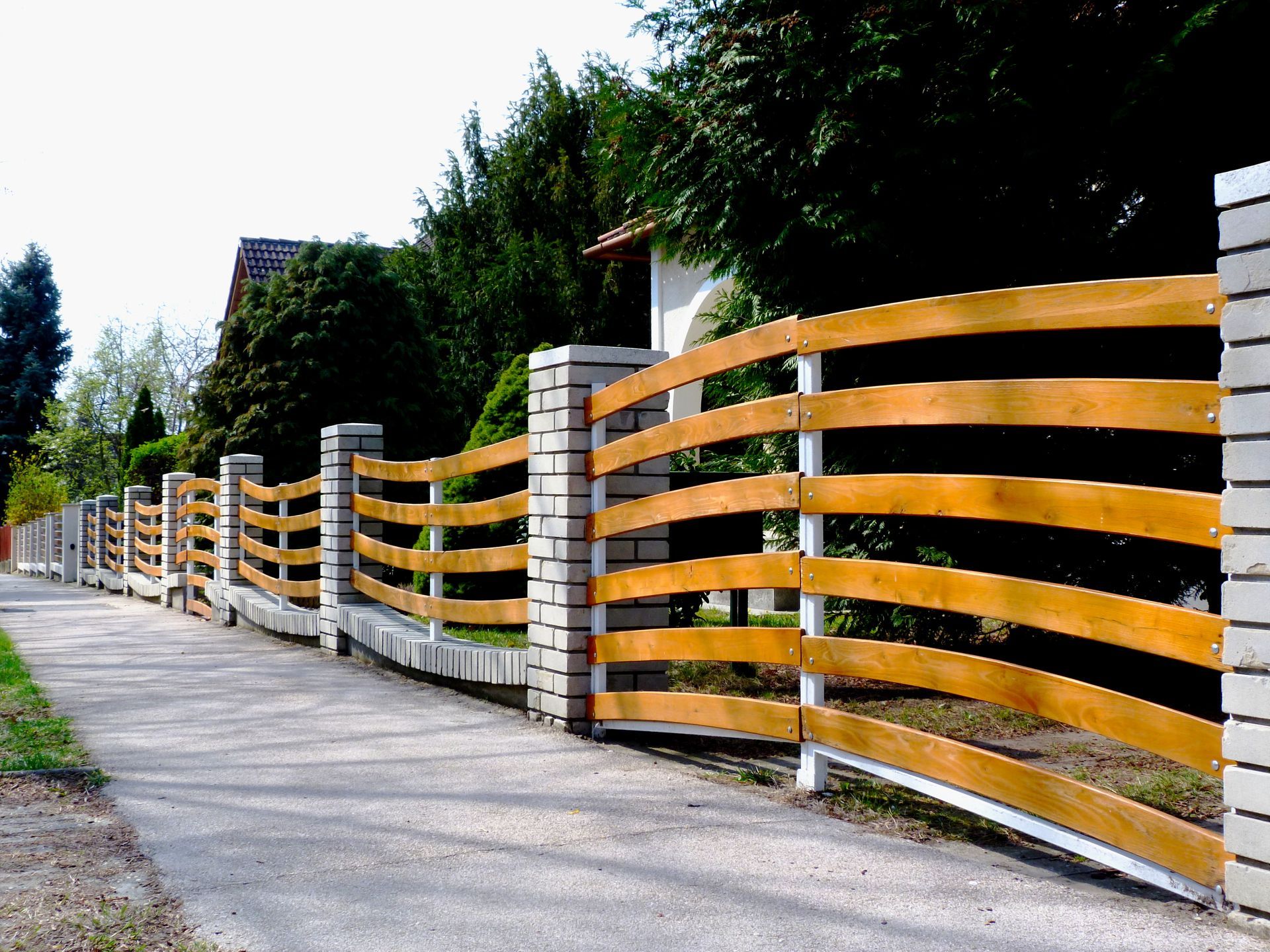 Wooden horizontal gates with stone pillars