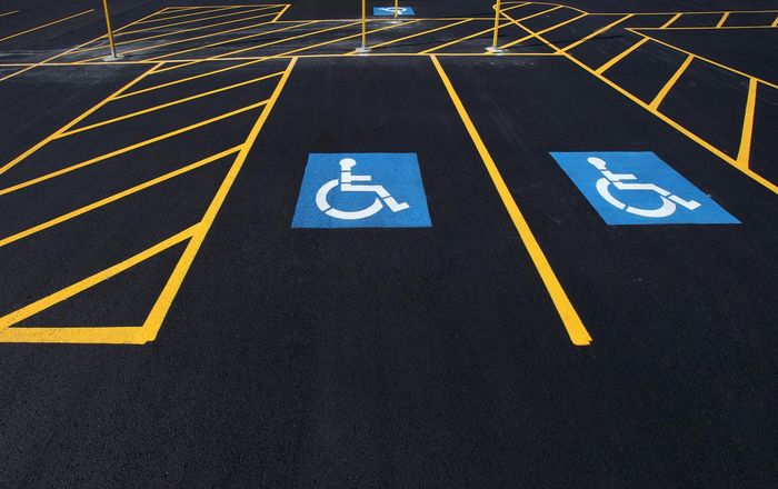 A parking lot with handicap signs painted on it