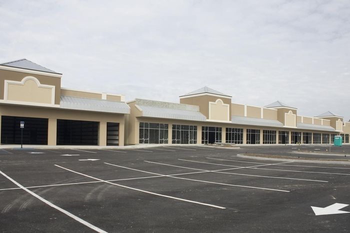 An empty parking lot with an arrow pointing to the right
