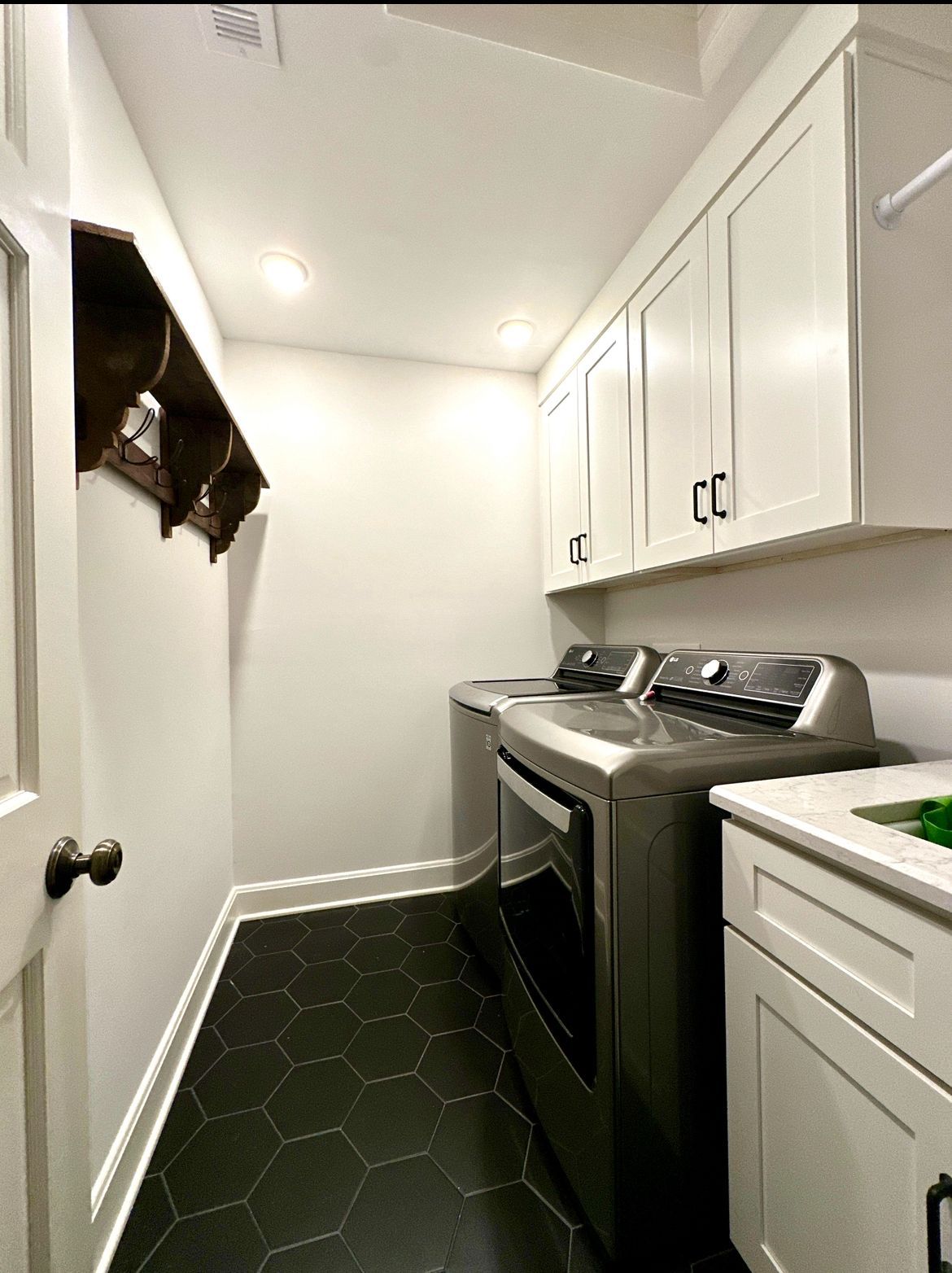 A laundry room with a washer and dryer in it
