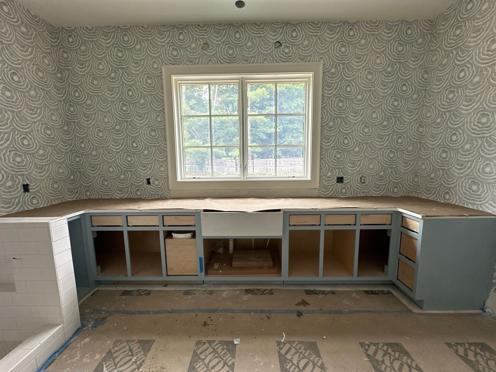 A kitchen with a large window and a lot of cabinets in Nashville, TN
