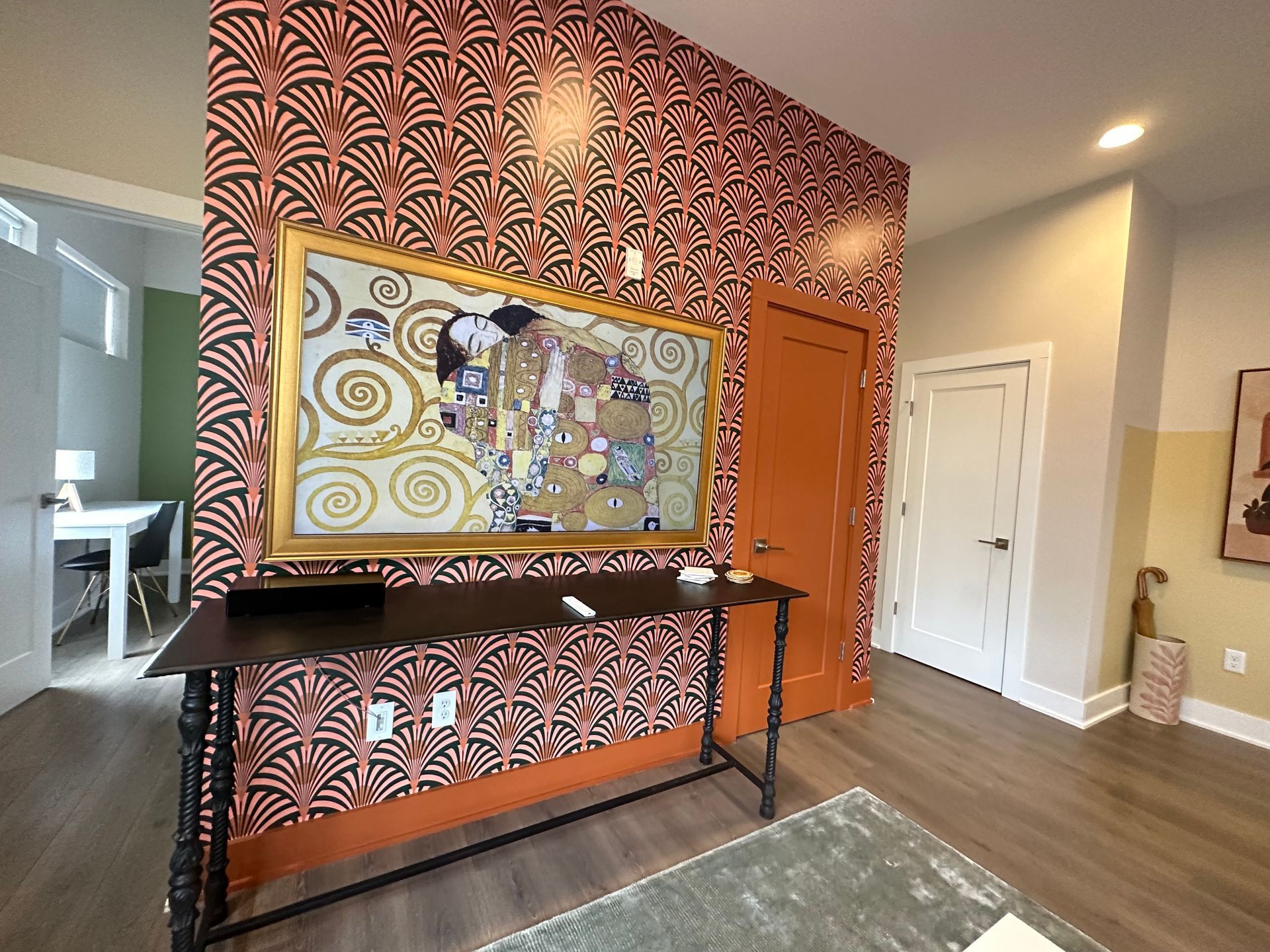 A living room with a painting on the wall above a desk in Nashville, TN