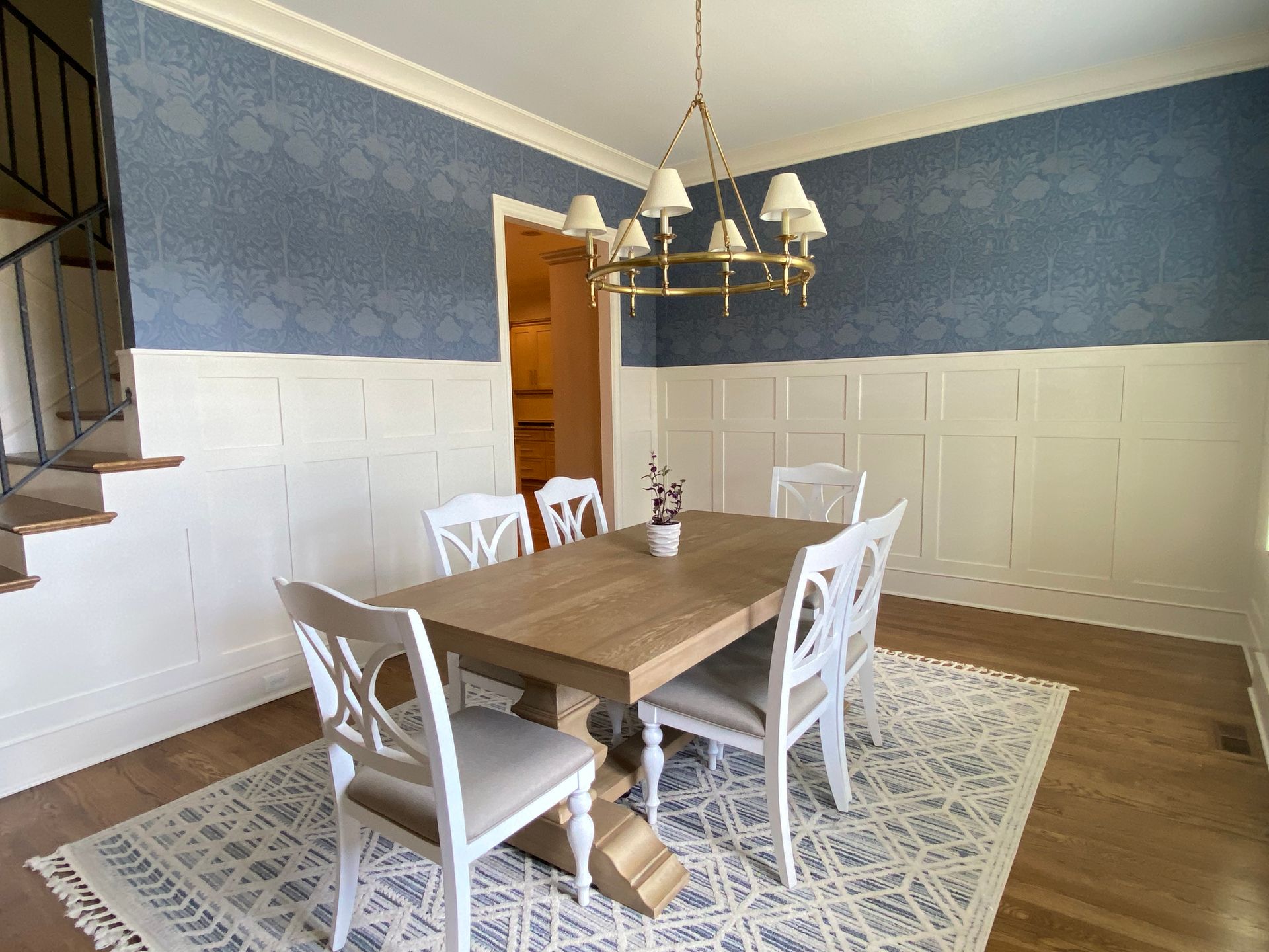A dining room with a table and chairs and a chandelier in Nashville, TN