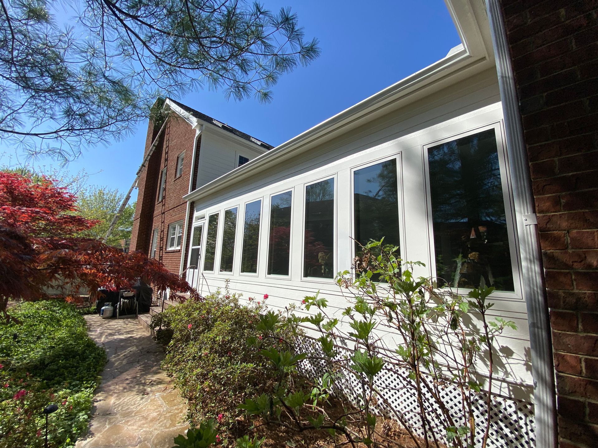 A house with a lot of windows and a driveway in Nashville, TN