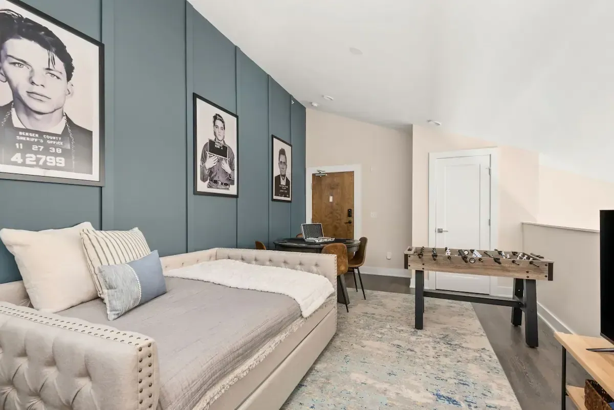 A bedroom with a day bed and a foosball table in Nashville, TN