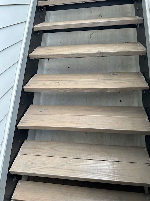 A set of wooden stairs leading up to a house in Nashville, TN