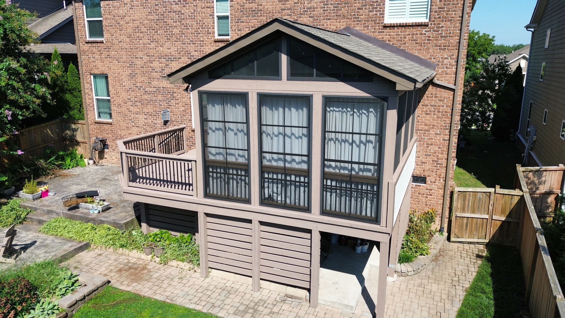 An aerial view of a house with a screened in porch in Nashville, TN