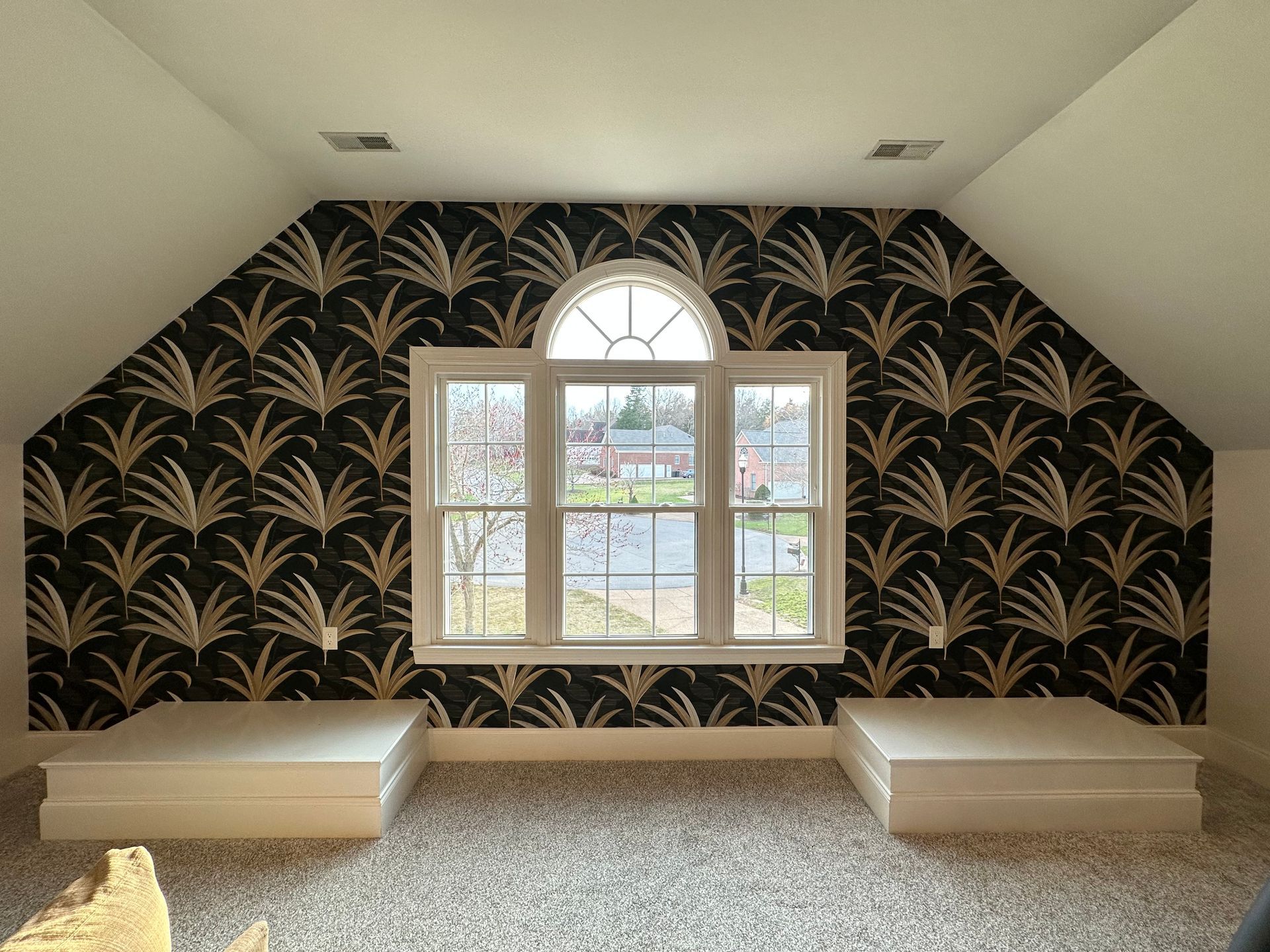 A room with a window and a black and gold wallpaper in Nashville, TN