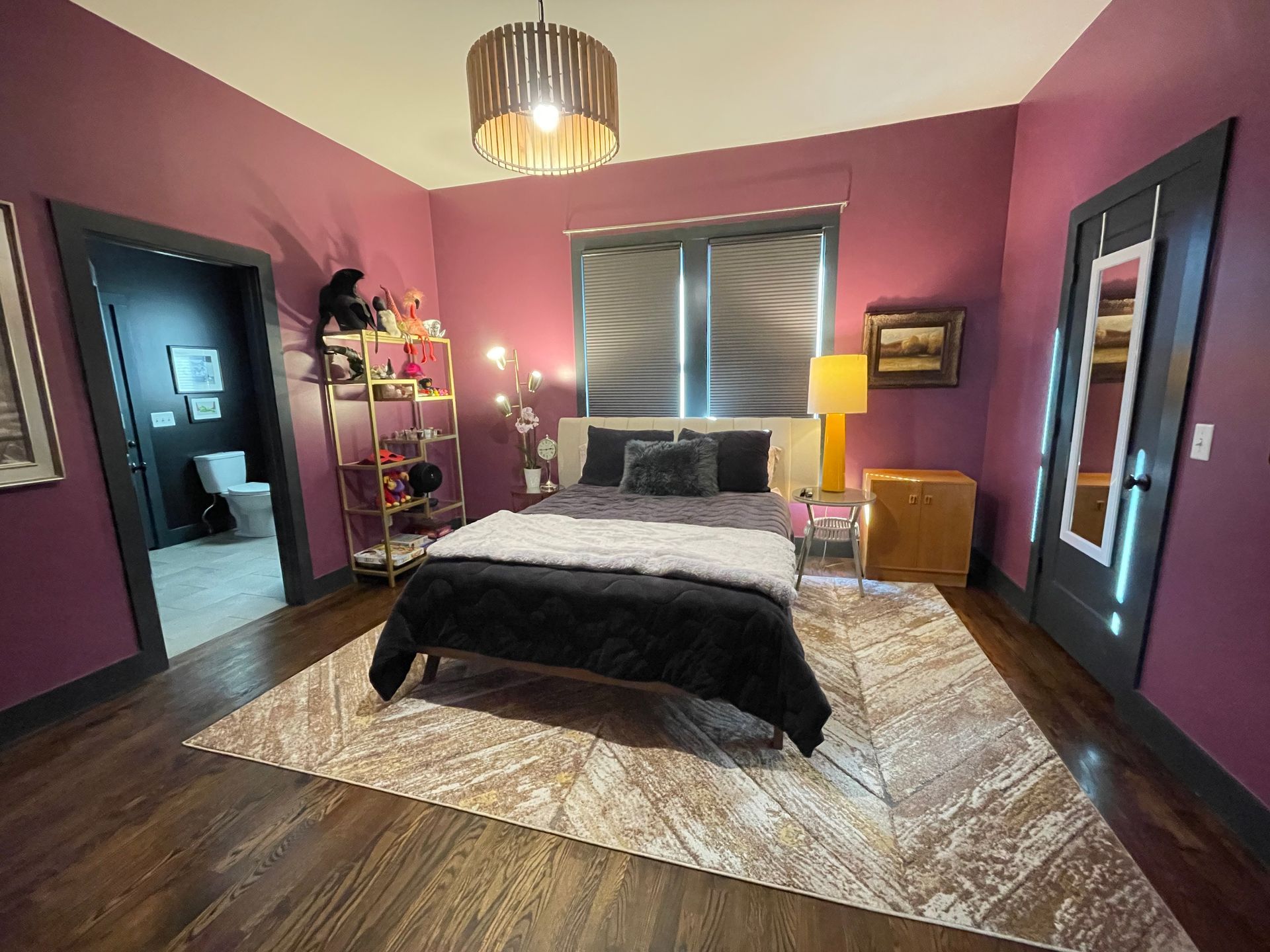 A bedroom with purple walls and a bed in Nashville, TN