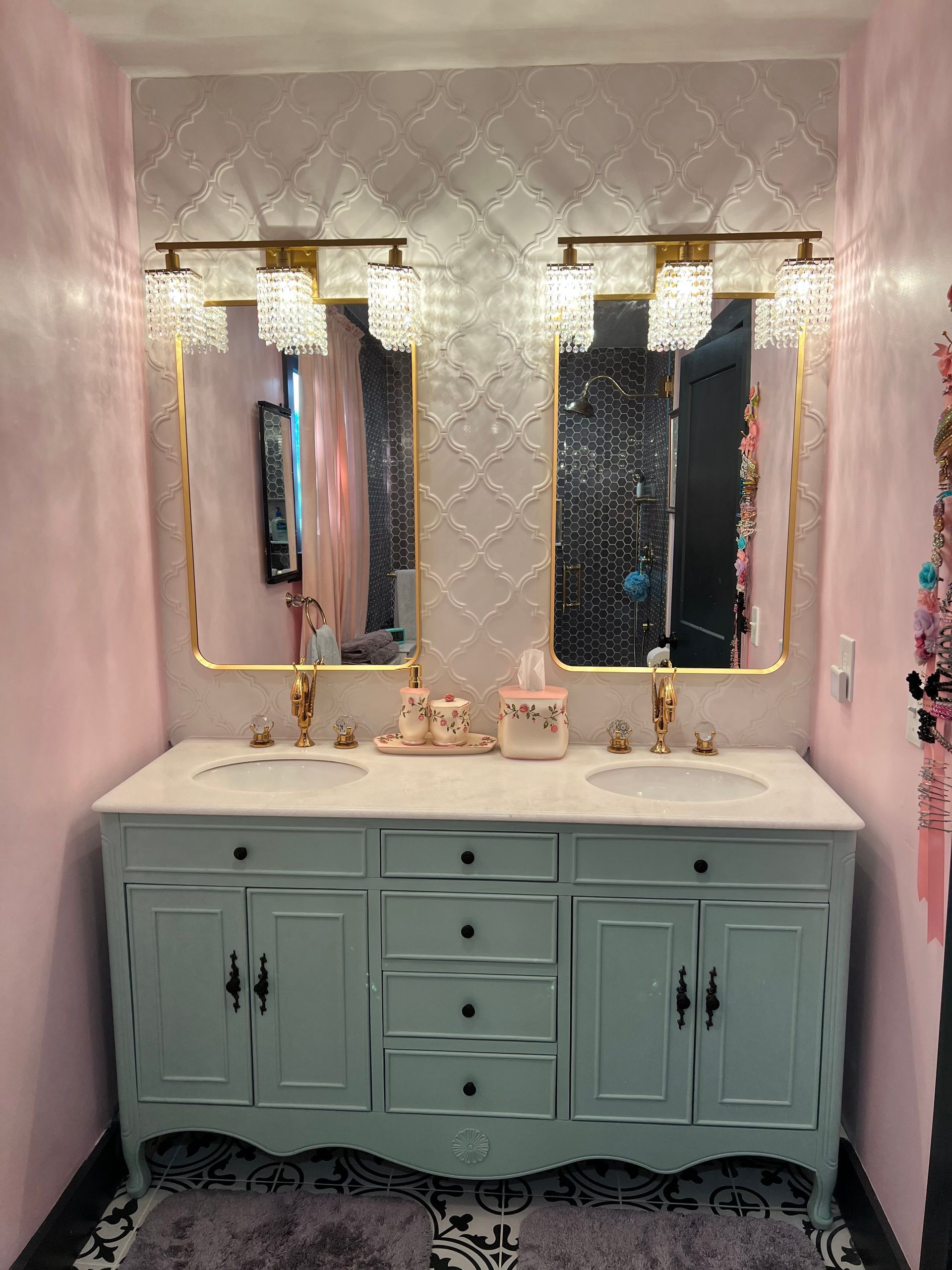 A bathroom with two sinks and two mirrors in Nashville, TN