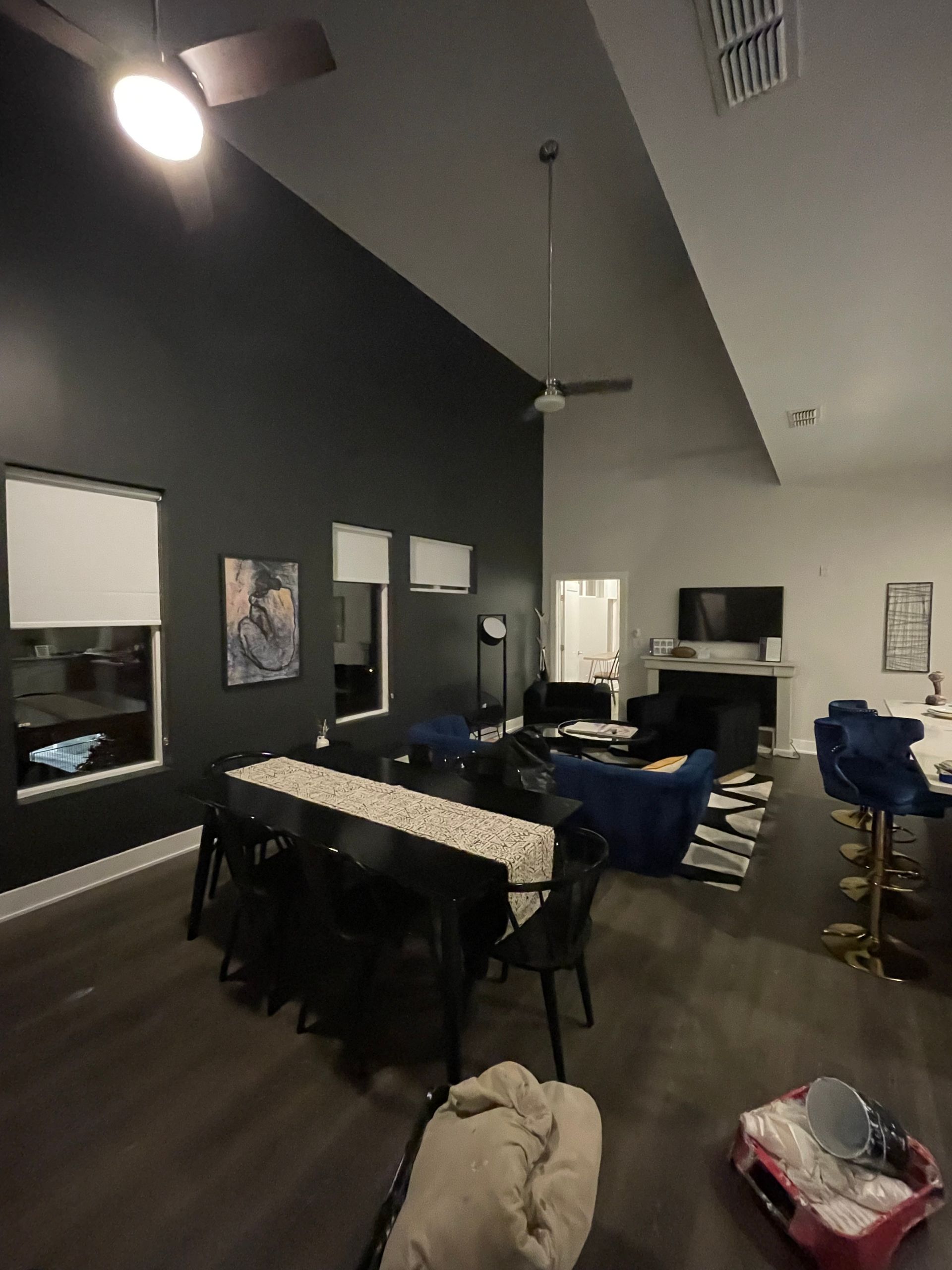 A living room with a table and chairs and a ceiling fan in Nashville, TN