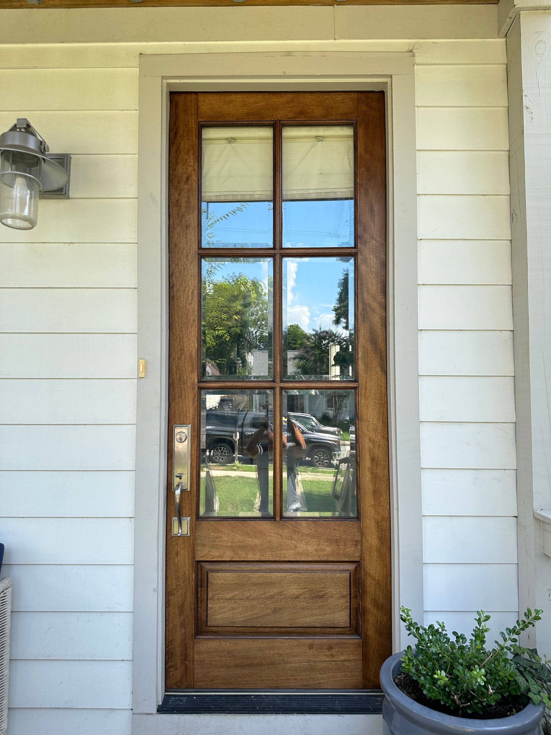 The front door of a house with a potted plant in front of it in Nashville, TN