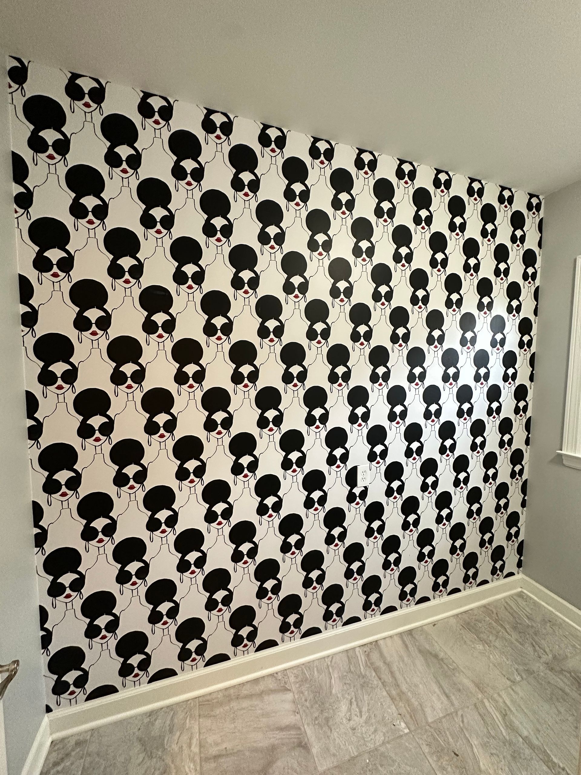 A wall with black and white skulls on it in Nashville, TN
