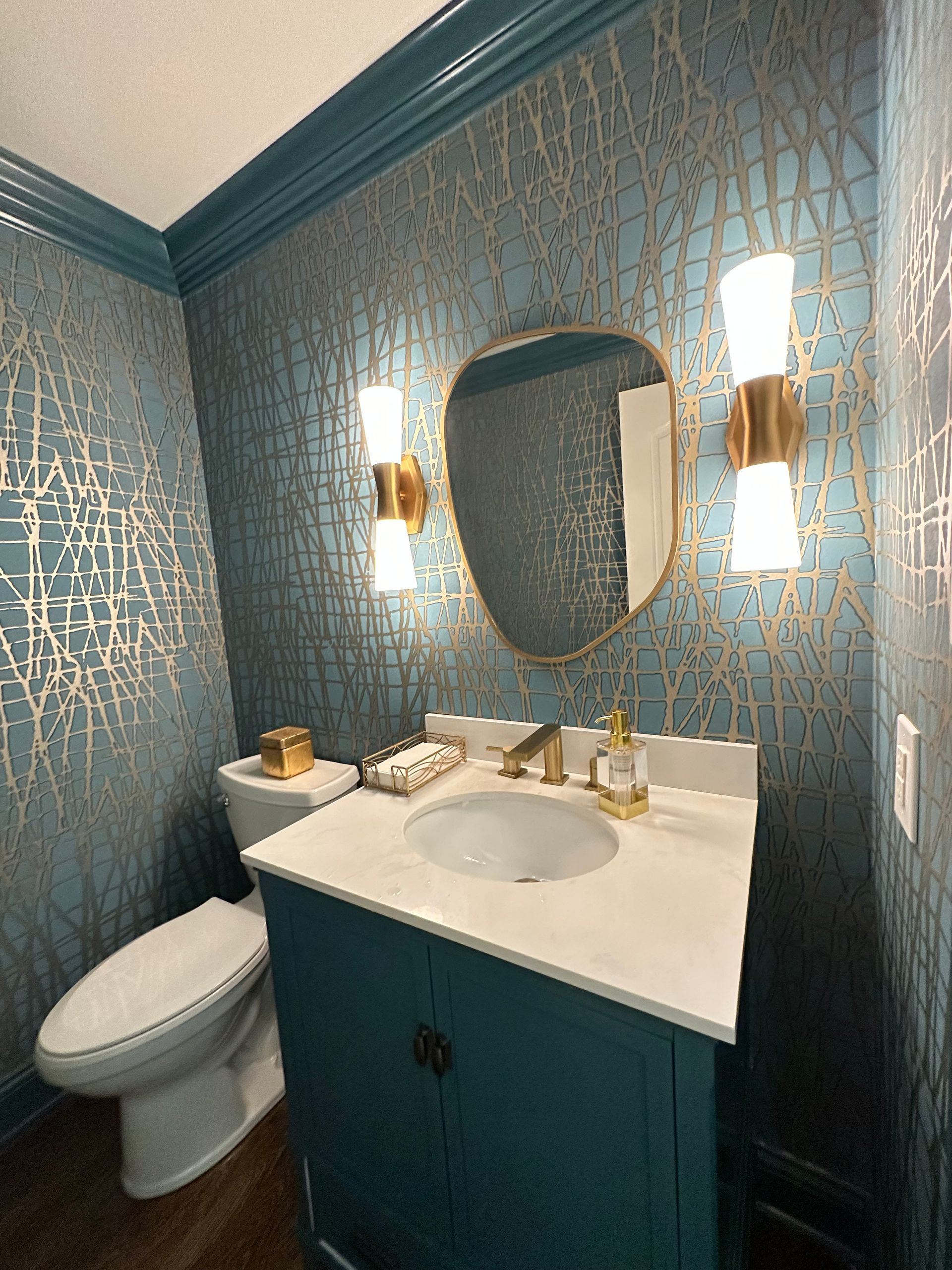 A bathroom with a toilet a sink and a mirror