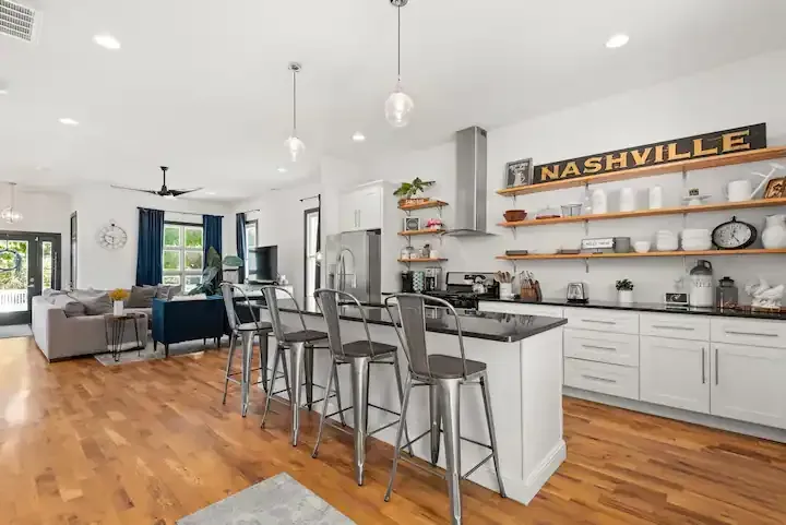 A kitchen with a sign on the wall that says nashville.