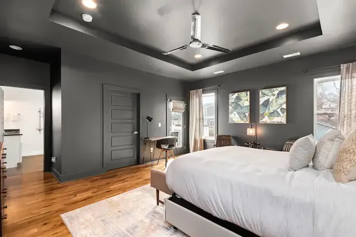 A bedroom with a large bed and a ceiling fan in Nashville, TN