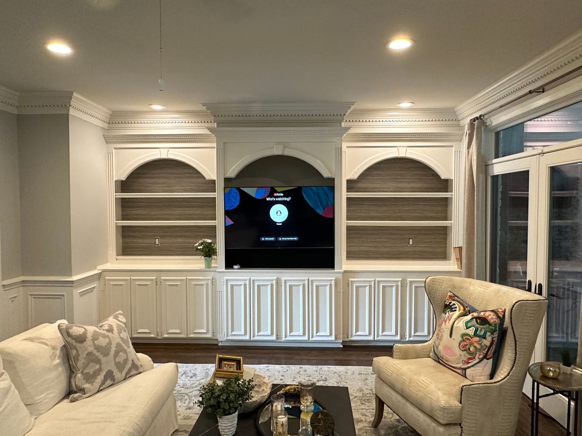 A living room with a couch , chair , and television in Nashville, TN