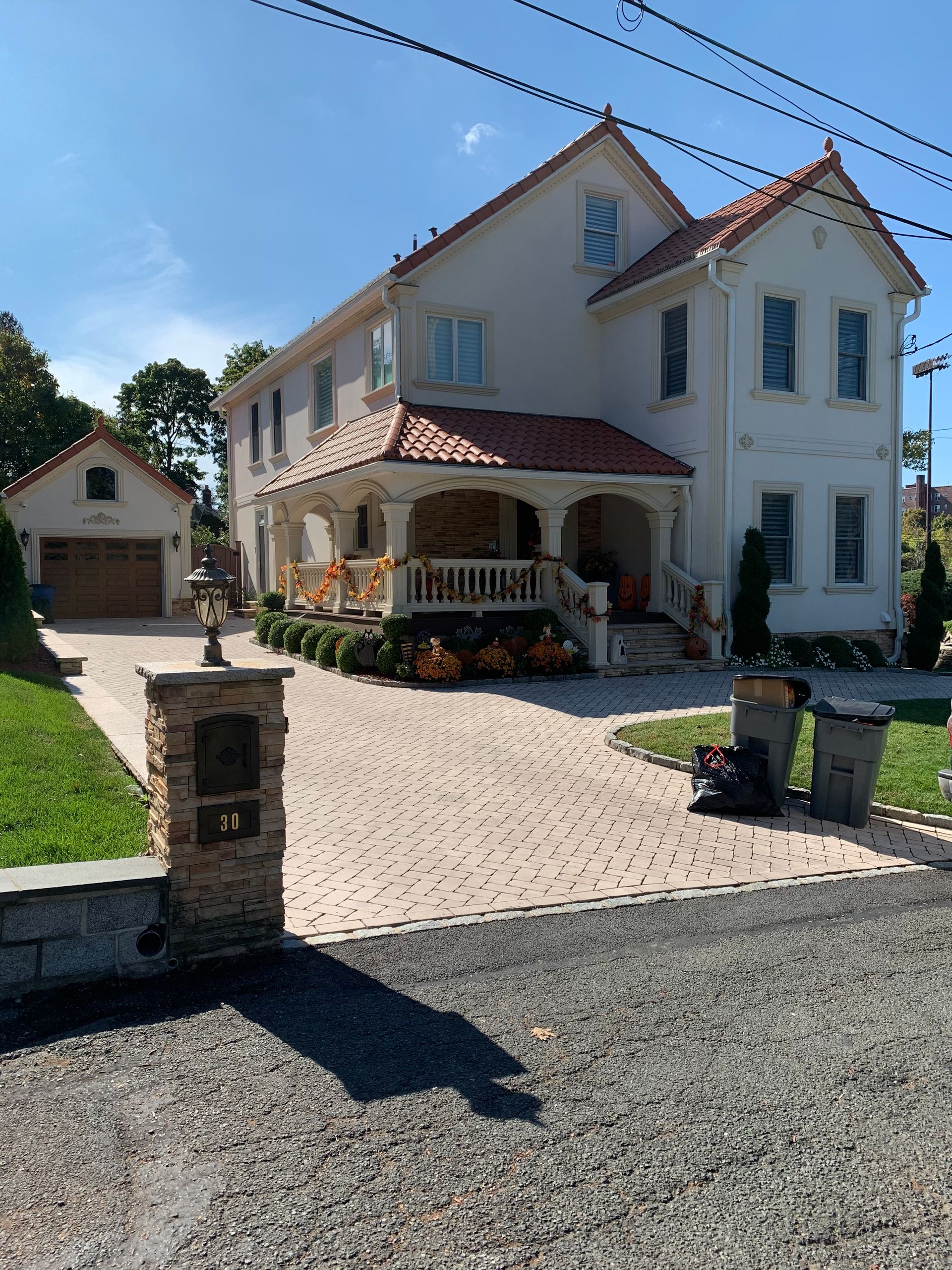 A large white house with a red tile roof