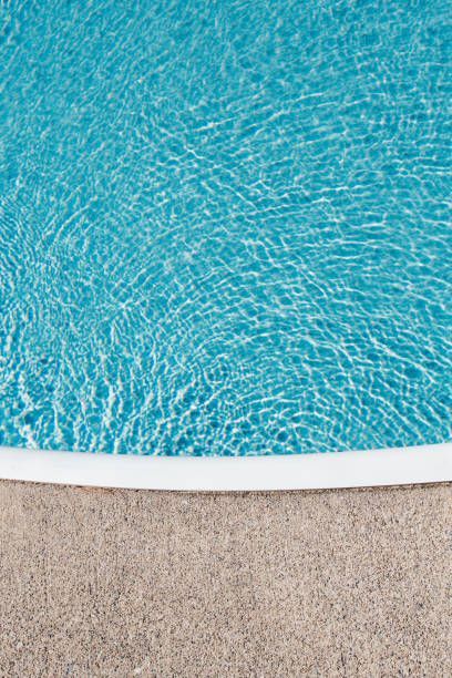 A close up of a swimming pool with blue water and a white border.