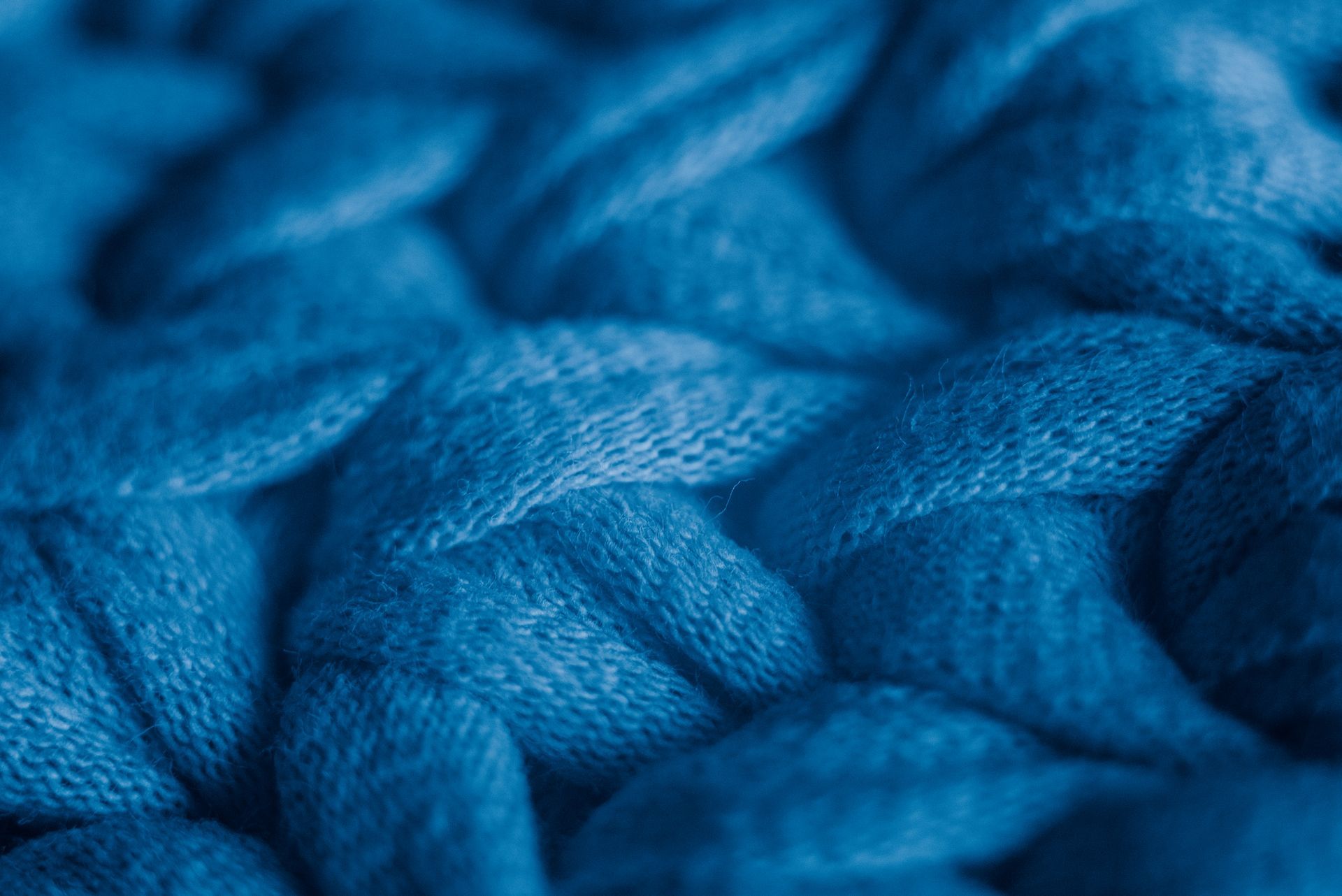 Tessuto a maglia blu intrecciato, primo piano.