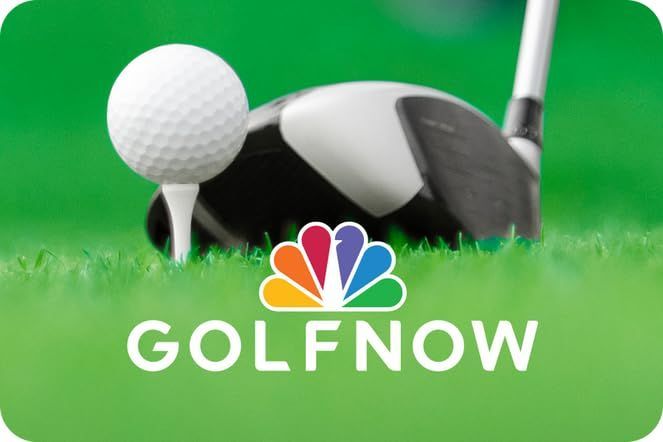 A golf ball is on a tee next to a golf club.