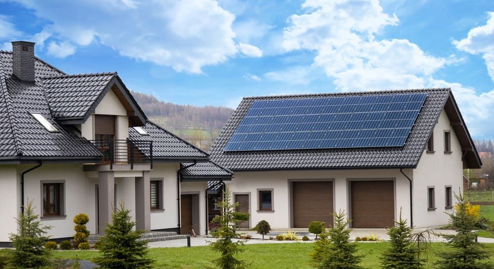 A House With A Lot Of Solar Panels On The Roof — Solarblu Pty Ltd In Dapto, NSW