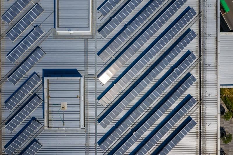 An Aerial View of a Building With Solar Panels on the Roof — Solarblu Pty Ltd in Kangaroo Valley, NSW