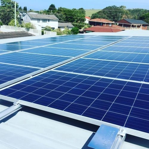 A Row of Solar Panels on the Roof of a Building — Solarblu Pty Ltd in Kangaroo Valley, NSW