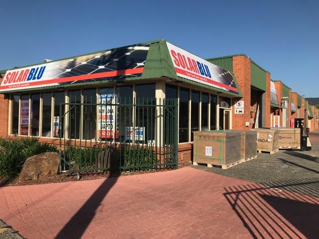 There Are Many Solar Panels On The Roof Of A House — Solarblu Pty Ltd In Dapto, NSW
