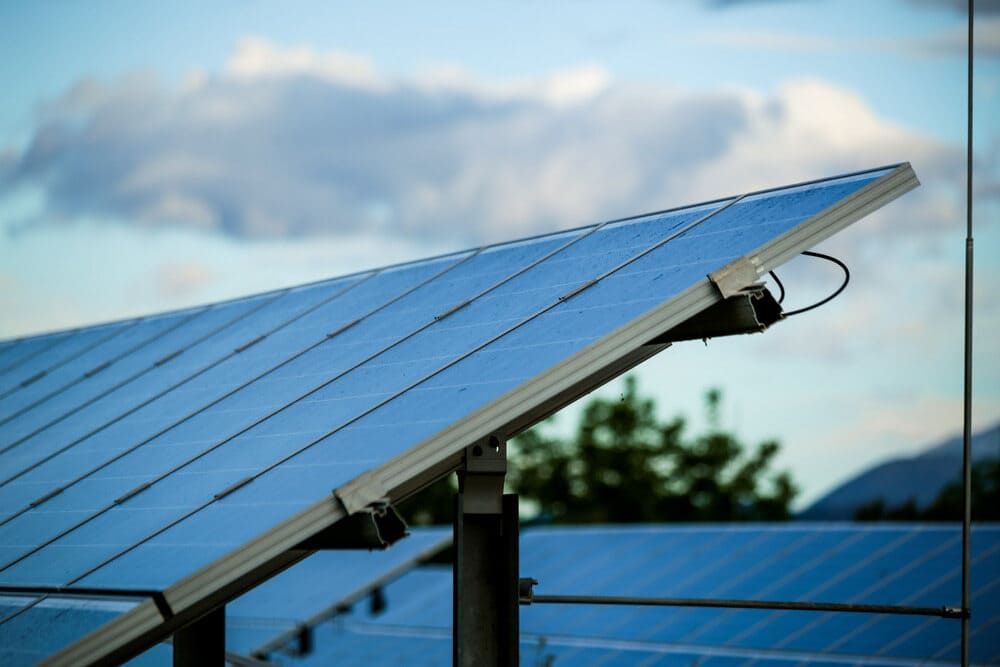 A Close Up Of A Solar Panel With A Cloudy Sky In The Background — Solarblu Pty Ltd In Woonona, NSW