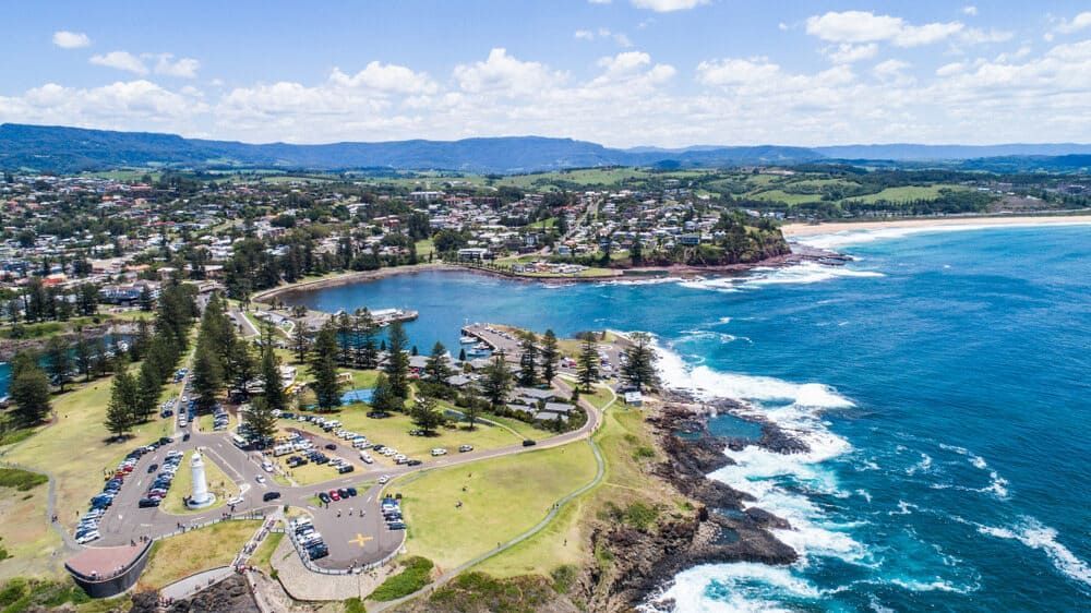 An Aerial View Of A City Next To A Body Of Water — Solarblu Pty Ltd In Kiama, NSW
