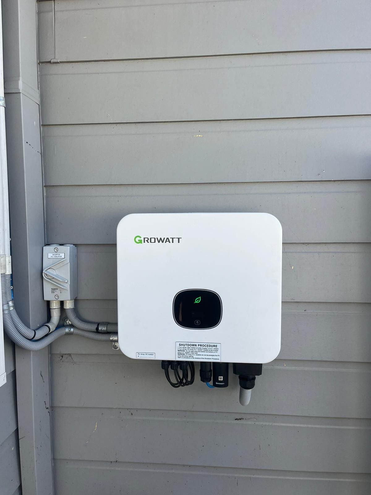 A solar inverter on an outside wall — Solarblu Pty Ltd In Shellharbour, NSW