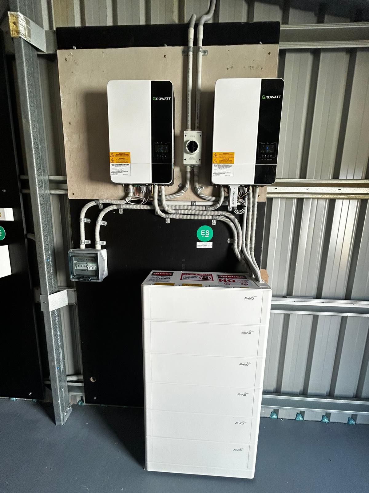 Solar inverter and batter on a wall — Solarblu Pty Ltd In Calderwood, NSW