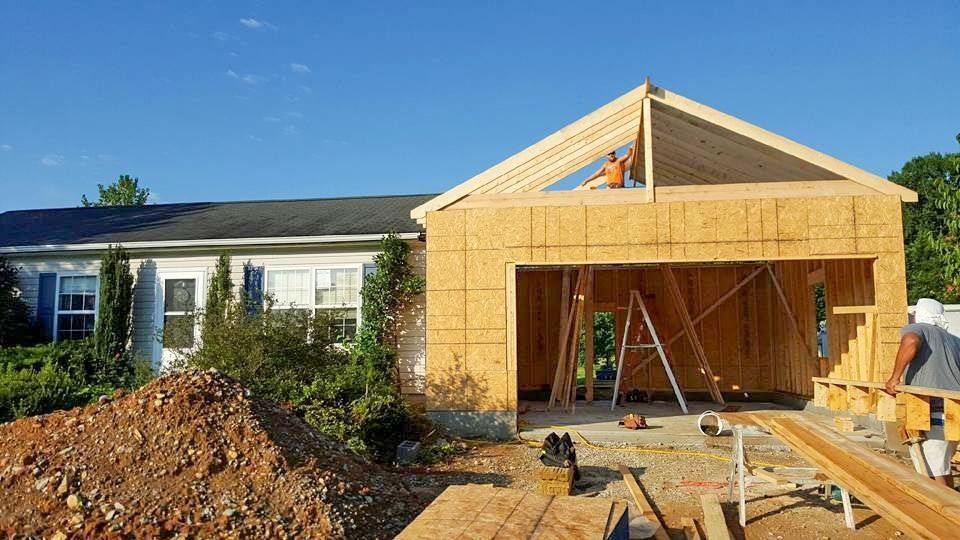 A house is being built with a garage attached to it.