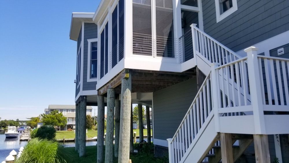 A house with stairs leading up to the second floor.