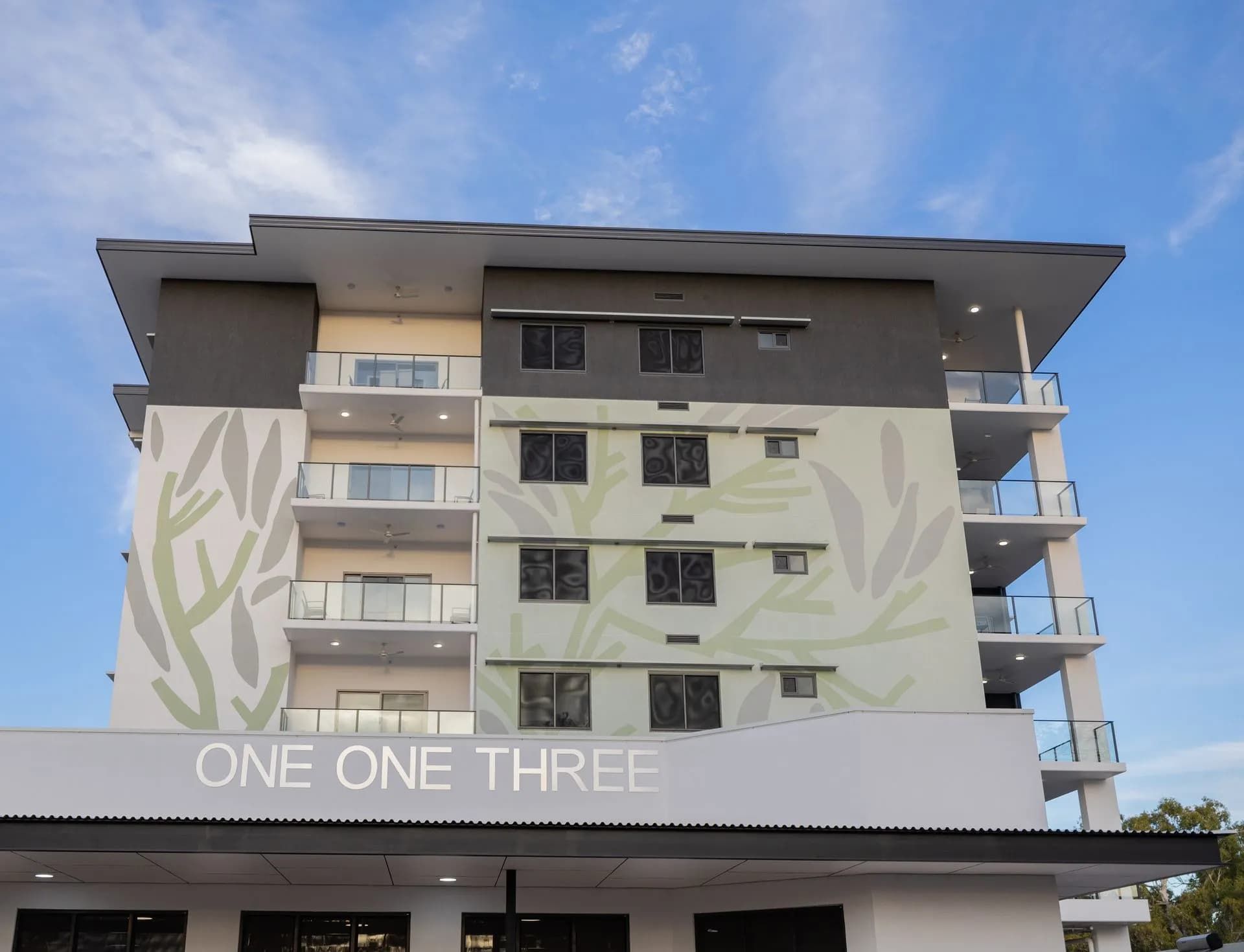 A Large Building With a Sign That Says One One Three  — NHM Painting & Projects Pty Ltd in Ciccone, NT